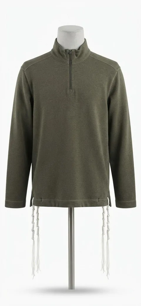 Piece 18: tzitzit tied into an olive quarter-zip, on a mannequin